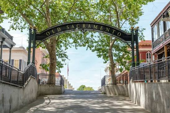 Old Sacramento historic district entrance arch under shade trees