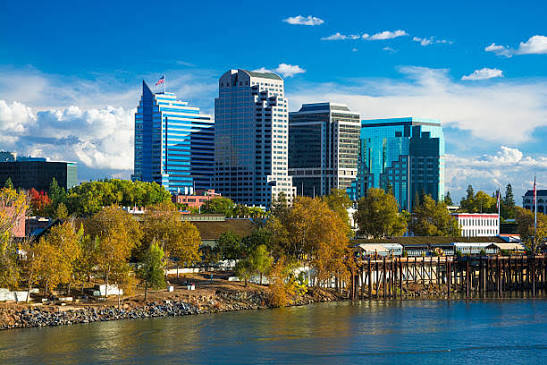 Sacramento downtown skyline seen across the Sacramento River on a clear day